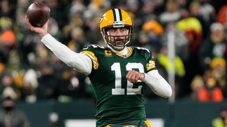 Green Bay Packers quarterback Aaron Rodgers (12) throws against the Los angles Rams in the first half of an NFL football game in Green Bay, Wis. Monday, Dec. 19, 2022. (Morry Gash/AP Photo)