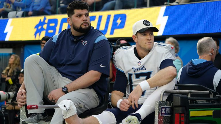 Tennessee Titans quarterback Ryan Tannehill, right, is carted off the field during the first half of an NFL football game against the Los Angeles Chargers in Inglewood, Calif., Sunday, Dec. 18, 2022. (Marcio Jose Sanchez/AP)