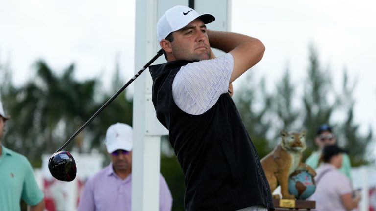 Scottie Scheffler, of the United States, watches his shot on the first tee during the first round of the Hero World Challenge PGA Tour at the Albany Golf Club, in New Providence, Bahamas, Thursday, Dec. 1, 2022. (Fernando Llano/AP Photo)