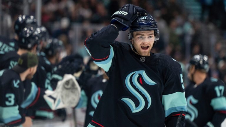 Seattle Kraken forward Shane Wright reacts after scoring a goal against the Montreal Canadiens during the first period of an NHL hockey game, Tuesday, Dec. 6, 2022, in Seattle. (Stephen Brashear/AP)