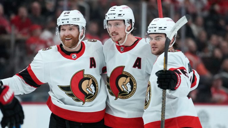 Ottawa Senators defenseman Thomas Chabot, center, celebrates his goal with Claude Giroux, left, and Alex DeBrincat in the first period of an NHL hockey game against the Detroit Red Wings Saturday, Dec. 17, 2022, in Detroit. (Paul Sancya/AP)