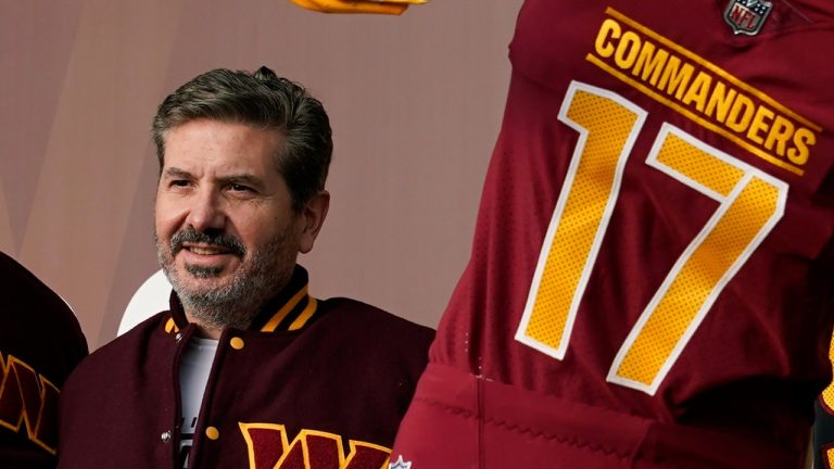 Washington Commanders' Dan Snyder poses for photos during an event to unveil the NFL football team's new identity, Feb. 2, 2022, in Landover, Md. Snyder and the organization are currently under investigation (Patrick Semansky/AP Photo)