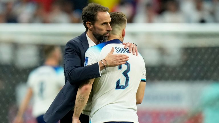 England's head coach Gareth Southgate embraces England's Luke Shaw at the end of the World Cup quarterfinal soccer match between England and France, at the Al Bayt Stadium in Al Khor, Qatar, Sunday, Dec. 11, 2022. France won 2-1. (Francisco Seco/AP)