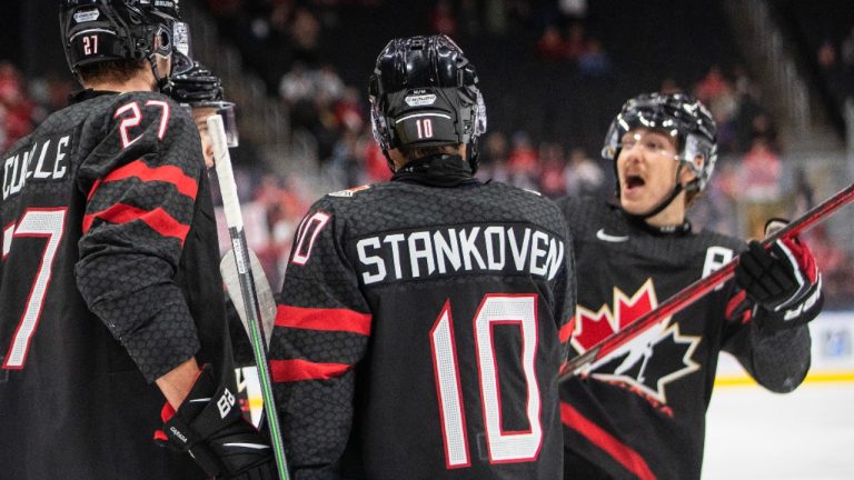 Canada's Will Cuylle (27), Logan Stankoven (10) and Donovan Sebrango (7) celebrate a goal against Switzerland during second period IIHF World Junior Hockey Championship quarterfinal action in Edmonton. (Jason Franson/CP)