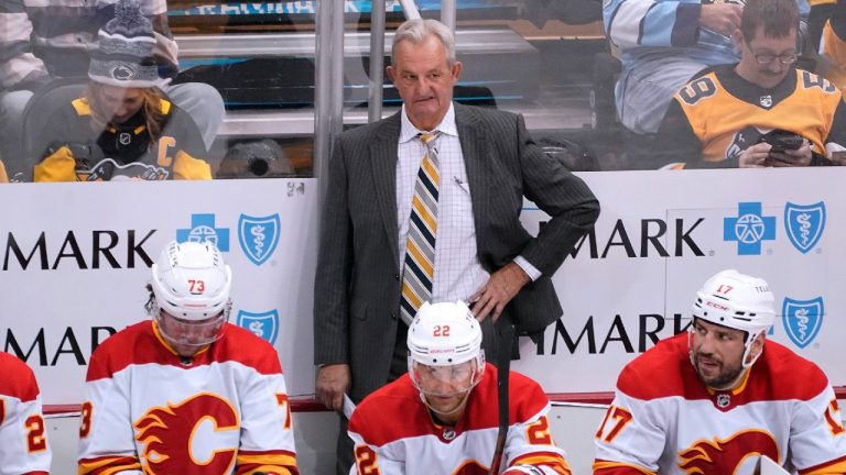 Calgary Flames coach Darryl Sutter stands behind the bench during the third period of the team's NHL hockey game against the Pittsburgh Penguins in Pittsburgh, Wednesday, Nov. 23, 2022. The Penguins won 2-1 in a shootout. (Gene J. Puskar/AP)