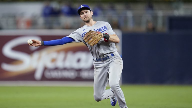 Los Angeles Dodgers shortstop Trea Turner throws to first for the out on San Diego Padres' Jake Cronenworth during the seventh inning in Game 3 of a baseball NL Division Series, Friday, Oct. 14, 2022, in San Diego. (Ashley Landis/AP)