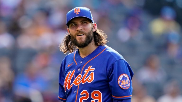 New York Mets starting pitcher Trevor Williams walks back to the dugout after he is relieved in the fourth inning of a baseball game against the Texas Rangers, Saturday, July 2, 2022, in New York. (John Minchillo/AP Photo)