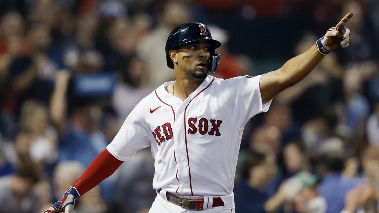 Former Boston Red Sox shortstop Xander Bogaerts celebrates after scoring on an RBI-double by Rafael Devers during the fifth inning of a baseball game against the Texas Rangers, Friday, Sept. 2, 2022 (Michael Dwyer/AP)