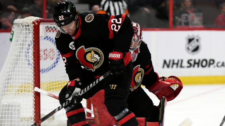 Ottawa Senators defenceman Nikita Zaitsev (22) works to clear the puck from in front of Senators goaltender Filip Gustavsson during first period NHL hockey action against the Florida Panthers in Ottawa on Thursday, April 28, 2022. (Justin Tang/CP)