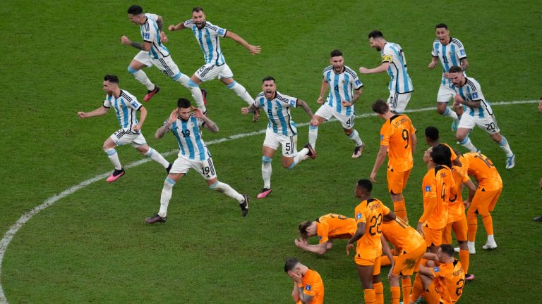 Argentina players celebrate at the end of the World Cup quarterfinal soccer match between the Netherlands and Argentina, at the Lusail Stadium in Lusail, Qatar, Saturday, Dec. 10, 2022. (Thanassis Stavrakis/AP) 