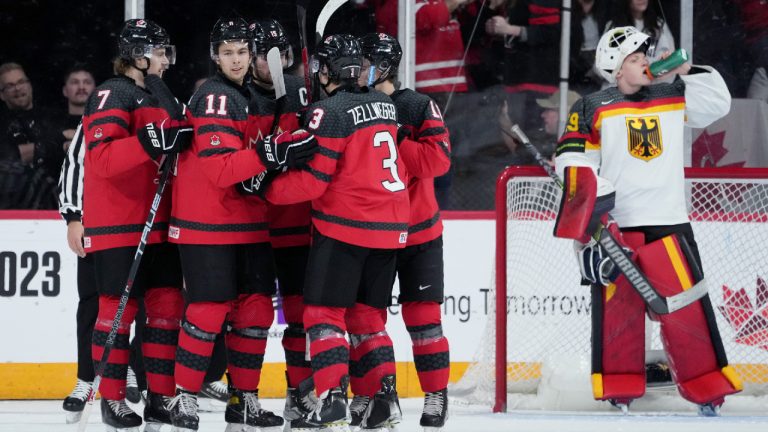 Canada’s Dylan Guenther, second from left, celebrates his goal with teammates in front of Germany goaltender Simon Wolf during first period IIHF World Junior Hockey Championship action in Halifax on Wednesday, December 28, 2022. (Darren Calabrese/CP)