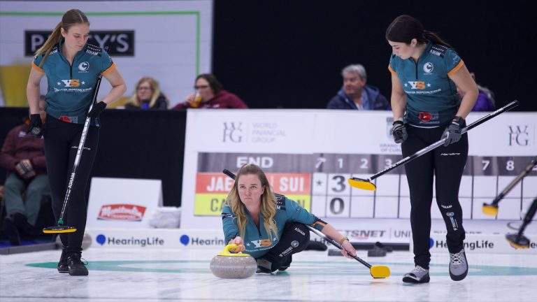 Chelsea Carey (centre) prepares to shoot a stone with sweepers Laurie St-Georges (left) and Rachel Erickson (right) during Draw 8 action in the WFG Masters on Dec. 7, 2022, at Sixteen Mile Sports Complex in Oakville, Ont. (Anil Mungal/GSOC)