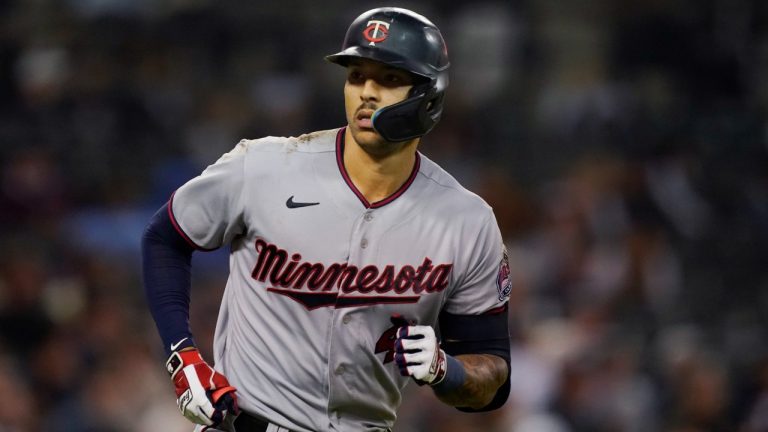 Minnesota Twins' Carlos Correa looks to the dugout after hitting a two-run home run during the seventh inning of a baseball game against the Detroit Tigers, Friday, Sept. 30, 2022, in Detroit. (Carlos Osorio/AP)