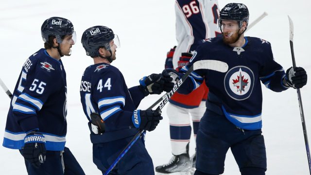 Hellebuyck, Pionk, Connor lead Jets to 2-1 win over Oilers - The San Diego  Union-Tribune