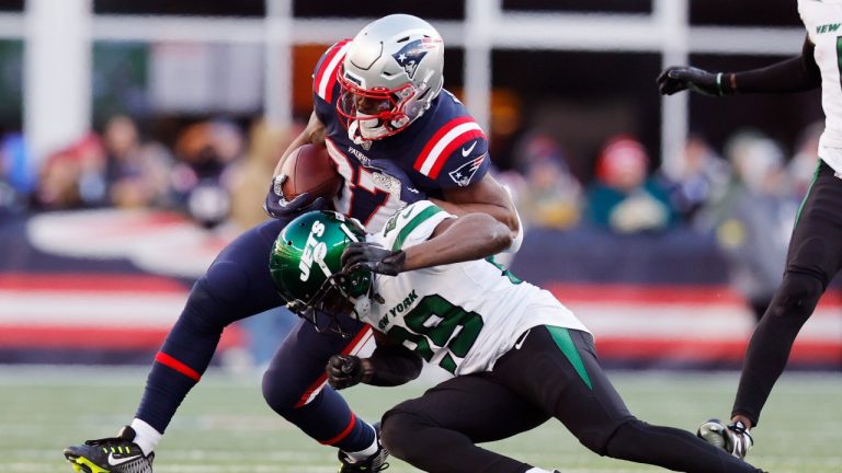 New York Jets safety Lamarcus Joyner (29) tackles New England Patriots running back Damien Harris, left, during the second half of an NFL football game, Sunday, Nov. 20, 2022, in Foxborough, Mass. (Michael Dwyer/AP)