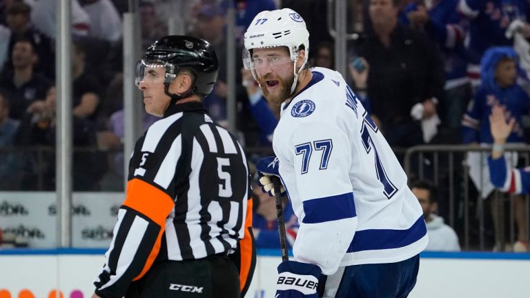 Tampa Bay Lightning defenseman Victor Hedman (77) argues with referee Chris Rooney (5) after being given a two minute penalty for tripping in the third period of Game 2 of the NHL hockey Stanley Cup playoffs Eastern Conference finals, Friday, June 3, 2022, in New York. (John Minchillo/AP) 