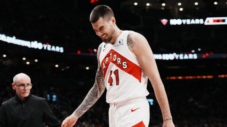 Toronto Raptors' Juancho Hernangomez winces as he leaves the game after an injury during first half NBA basketball action against Orlando Magic in Toronto on Saturday, December 3, 2022. (Chris Young/CP)