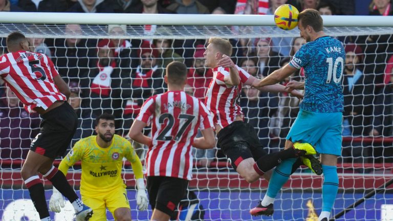 Tottenham's Harry Kane, right, scores his side's first goal during the English Premier League soccer match between Brentford and Tottenham Hotspur at the Gtech Community Stadium in London, Monday, Dec. 26, 2022. (Kirsty Wigglesworth/AP) 