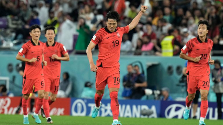 South Korea's Kim Young-gwon celebrates after scoring his side's first goal during the World Cup group H soccer match between South Korea and Portugal, at the Education City Stadium in Al Rayyan. (Hassan Ammar/AP)