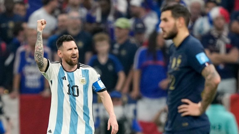 Argentina's Lionel Messi celebrates after scoring the opening goal from the penalty spot during the World Cup final soccer match between Argentina and France at the Lusail Stadium in Lusail, Qatar, Sunday, Dec. 18, 2022. (Martin Meissner/AP)