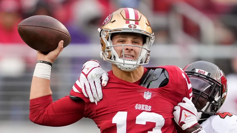 San Francisco 49ers quarterback Brock Purdy (13) passes as Tampa Bay Buccaneers linebacker Devin White applies pressure during the first half of an NFL football game in Santa Clara, Calif., Sunday, Dec. 11, 2022. (AP Photo/Tony Avelar)