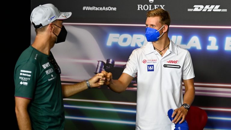 Haas driver Mick Schumacher of Germany, right, greets Aston Martin driver Sebastian Vettel of Germany at a news conference at the Red Bull Ring racetrack in Spielberg, Austria, Thursday, June 24, 2021. The Styrian Formula One Grand Prix will be held on Sunday, June 27, 2021. (Christian Bruna/Pool via AP)