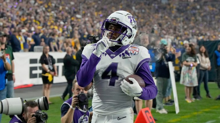 TCU wide receiver Taye Barber (4) celebrates his touchdown against Michigan during the first half of the Fiesta Bowl NCAA college football semifinal playoff game, Saturday, Dec. 31, 2022, in Glendale, Ariz. (Rick Scuteri/AP Photo)