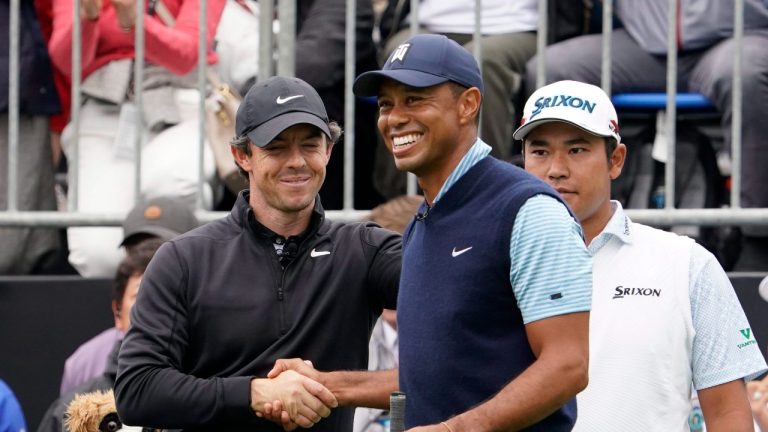 Tiger Woods of the United States, centre, shakes hands with Rory McIlroy of Northern Ireland, left, as Hideki Matsuyama of Japan, right, stands during the Challenge: Japan Skins event ahead of the Zozo Championship PGA Tour at Accordia Golf Narashino C.C. in Inzai, east of Tokyo, Monday, Oct. 21, 2019. (Lee Jin-man/AP Photo)