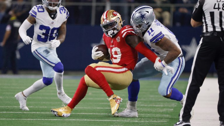 San Francisco 49ers wide receiver Deebo Samuel (19) is stopped after a short gain by Dallas Cowboys outside linebacker Micah Parsons (11). (Ron Jenkins/AP)