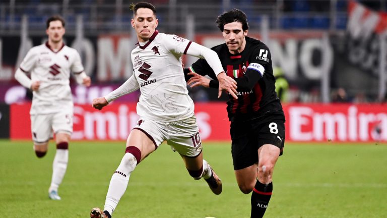 Torino's Sasa Lukic and Milan's Sandro Tonali fight for the ball during the round of 16 Italian Cup soccer match between AC Milan and Torino FC, at San Siro Stadium in Milan, Italy, Wednesday, Jan. 11, 2023. (Marco Alpozzi/LaPresse via AP)