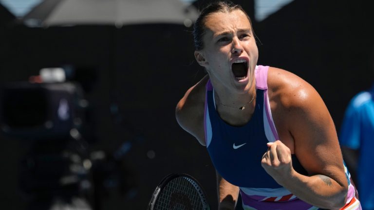 Aryna Sabalenka of Belarus celebrates after defeating Belinda Bencic of Switzerland in their fourth round match at the Australian Open tennis championship in Melbourne, Australia, Monday, Jan. 23, 2023. (Aaron Favila/AP)