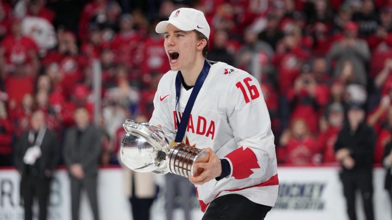 Canada's Connor Bedard carries the IIHF Championship Cup while celebrating winning over Czechia at the IIHF World Junior Hockey Championship gold medal game in Halifax on Thursday, January 5, 2023. (Darren Calabrese/THE CANADIAN PRESS)