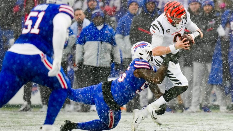 Cincinnati Bengals quarterback Joe Burrow (9) is tackled by Buffalo Bills defensive end Boogie Basham (55) during the first quarter of an NFL division round football game, Sunday, Jan. 22, 2023, in Orchard Park, N.Y. (Seth Wenig/AP)