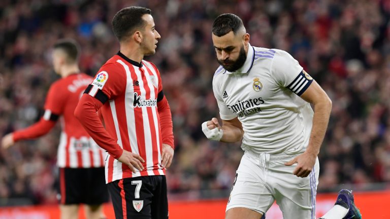 Real Madrid's Karim Benzema, right, celebrates after scoring the opening goal during the Spanish La Liga soccer match between Athletic Club Bilbao and Real Madrid at the San Mames stadium in Bilbao, Spain, Sunday, Jan. 22, 2023. (Alvaro Barrientos/AP)