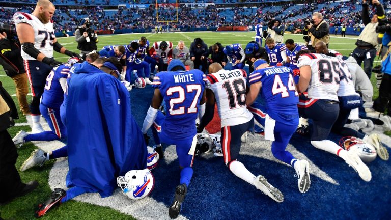 Players gather for a prayer after an NFL football game between the Buffalo Bills and the New England Patriots, Sunday, Jan. 8, 2023, in Orchard Park. (Adrian Kraus/AP)