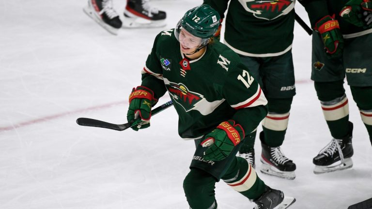 Minnesota Wild left wing Matt Boldy skates to the bench to celebrate after scoring against the Edmonton Oilers during the first period of an NHL hockey game, Monday, Dec. 12, 2022, in St. Paul, Minn. (Craig Lassig/AP)