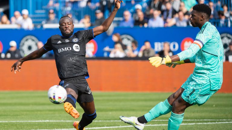 CF Montréal forward Kei Kamara (23) moves in on New York City goalkeeper Sean Johnson (1) during first half Eastern Conference semifinals MLS playoff soccer action in Montreal, Sunday, October 23, 2022. (Graham Hughes/CP)