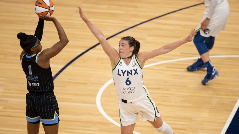 Chicago Sky's Diamond DeShields (1) hit a first-half jump shot over Minnesota Lynx and Canada Basketball forward Bridget Carleton (6) during a WNBA basketball game. (Jerry Holt/Star Tribune via AP)