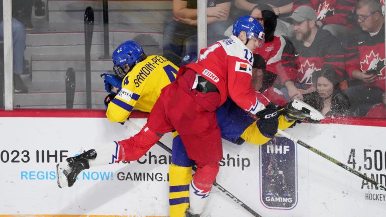 Axel Sandin-Pellikka of Sweden, left, and Czechia’s Adam Mechura of Czechia collide into the boards during second period IIHF World Junior Hockey Championship semifinal action. (Darren Calabrese/CP)