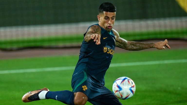 Portugal's Joao Cancelo shoots the ball during his team training session at the World Cup in Doha, Qatar, Thursday, Dec. 8, 2022. (Francisco Seco/AP) 