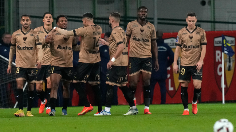 Lens' Lois Openda, third left, celebrates after scoring his side's second goal during the French League One soccer match between Lens and Paris Saint-Germain at the Bollaert stadium in Lens, France Sunday, Jan. 1, 2023 (AP)