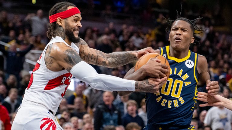 Indiana Pacers guard Bennedict Mathurin (00) reacts as he is fouled by Toronto Raptors guard Gary Trent Jr. during the second half of an NBA basketball game in Indianapolis, Monday, Jan. 2, 2023. (AP Photo/Doug McSchooler)