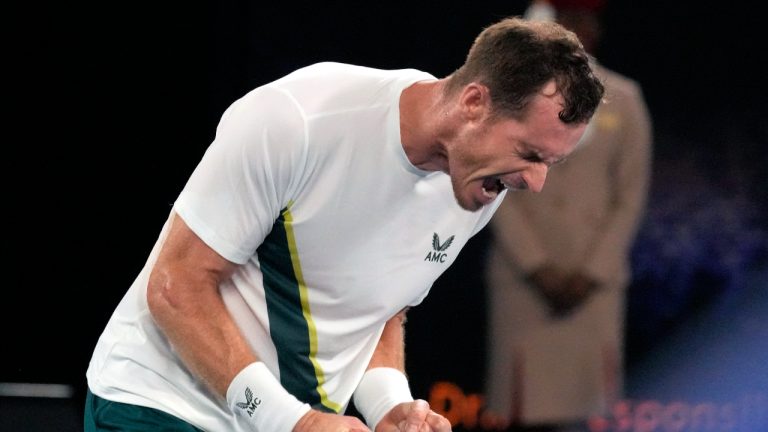 Andy Murray of Britain reacts after defeating Matteo Berrettini of Italy in their first round match at the Australian Open tennis championship in Melbourne, Australia, Tuesday, Jan. 17, 2023. (AP Photo/Aaron Favila)