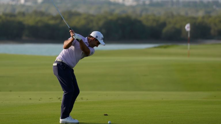 Edoardo Molinari of Italy plays a ball on the 18th hole during the first round of Abu Dhabi HSBC Golf Championship, in Abu Dhabi, United Arab Emirates, Thursday, Jan. 19, 2023. (AP)