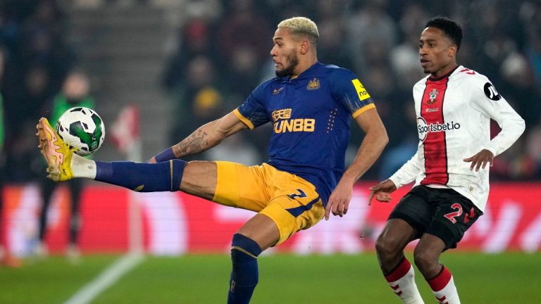 Newcastle's Joelinton, left, duels for the ball with Southampton's Kyle Walker-Peters during the EFL Cup semifinal, first leg soccer match between Southampton and Newcastle United at St Mary's Stadium in Southampton, England, Tuesday, Jan. 24, 2023. (Kin Cheung/AP Photo)