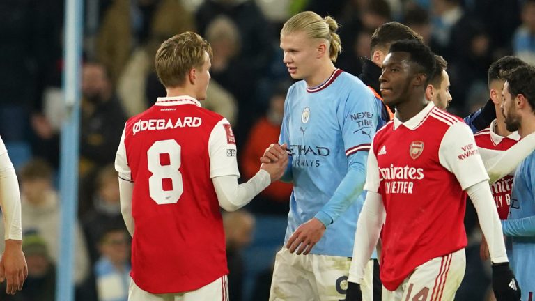 Arsenal's Martin Odegaard, left, talks with Manchester City's Erling Haaland at the end of the English FA Cup 4th round soccer match between Manchester City and Arsenal. (Dave Thompson/AP)