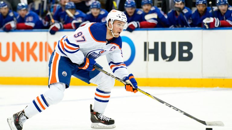 Edmonton Oilers center Connor McDavid skates with the puck during the first period of an NHL hockey game. (Julia Nikhinson/AP)