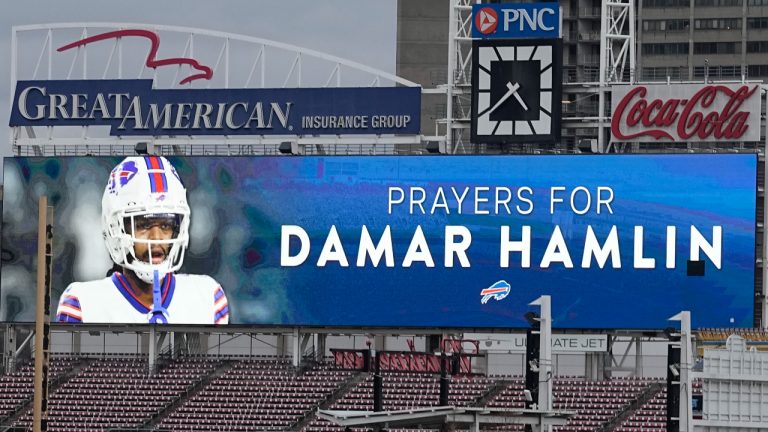 A scoreboard at Great American Ballpark displays a photo of Buffalo Bills' Damar Hamlin, Tuesday, Jan. 3, 2023, in Cincinnati.(Darron Cummings/AP)