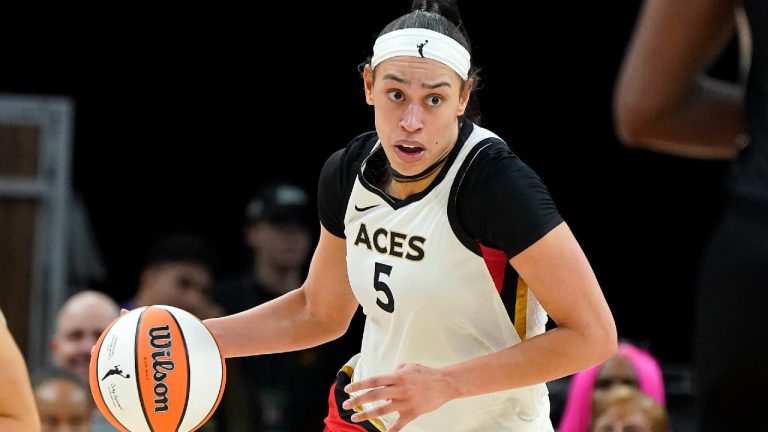 Las Vegas Aces' Dearica Hamby (5) dribbles up court during a WNBA basketball game against the Phoenix Mercury, on May 6, 2022, in Phoenix.  (Darryl Webb/AP)