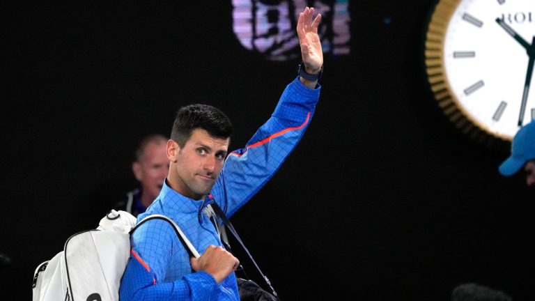 Novak Djokovic of Serbia waves as he leaves Rod Laver Arena following his third round match against Grigor Dimitrov of Bulgaria at the Australian Open tennis championship in Melbourne, Australia, Saturday, Jan. 21, 2023. (Aaron Favila/AP Photo)